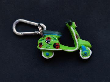Schlüsselanhänger Kautschuk Roller grün Marienkäfer